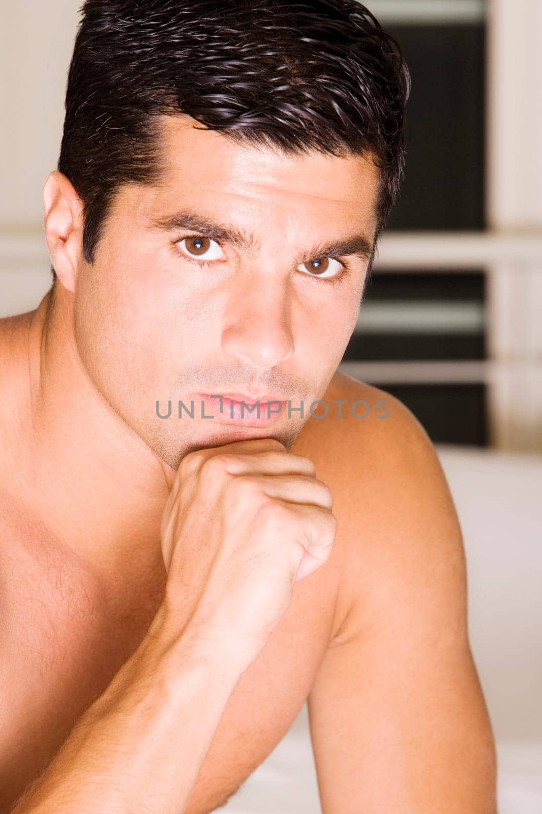 Portrait of a mid adult man with his hand on his chin