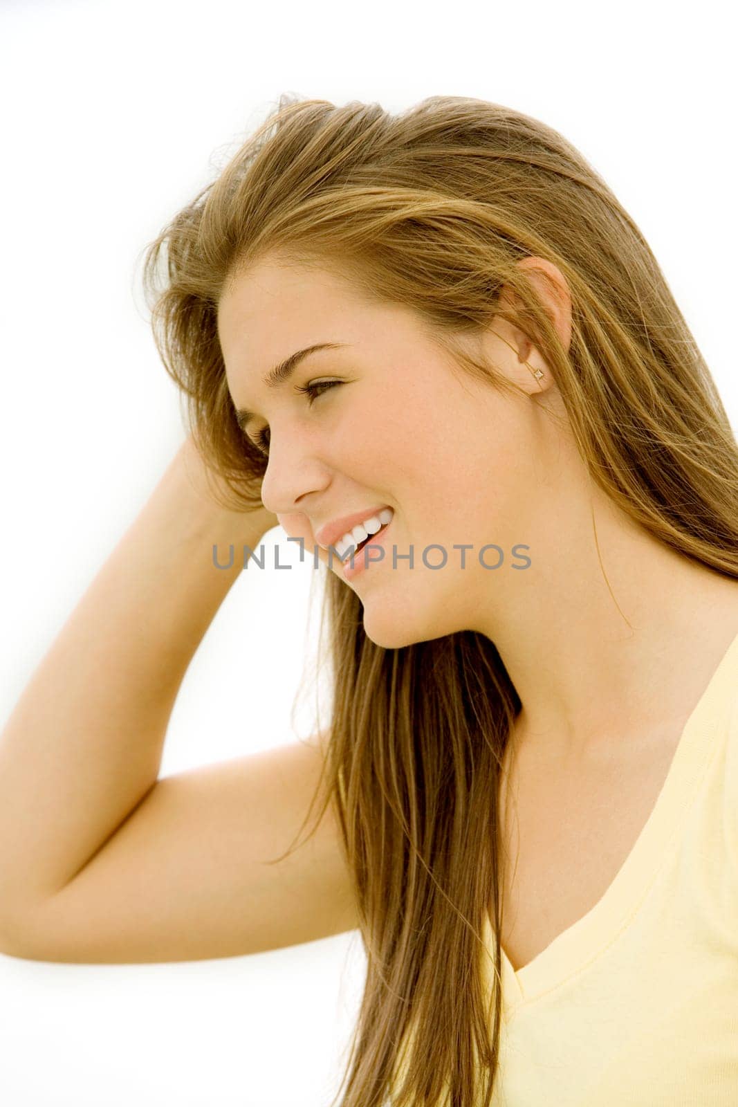 Close-up of a teenage girl with her hand in her hair