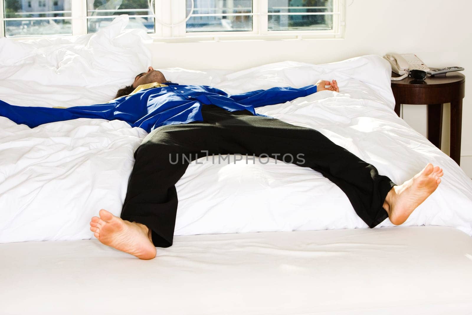 Mid adult man lying on the bed