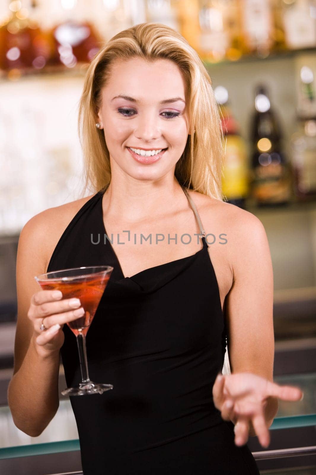 Close-up of a young woman holding a glass of wine
