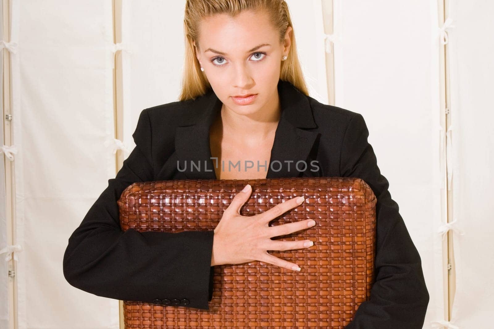Portrait of a young woman sitting on a chair