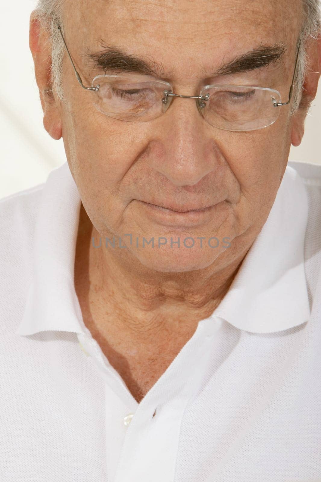 Close-up of a senior man thinking