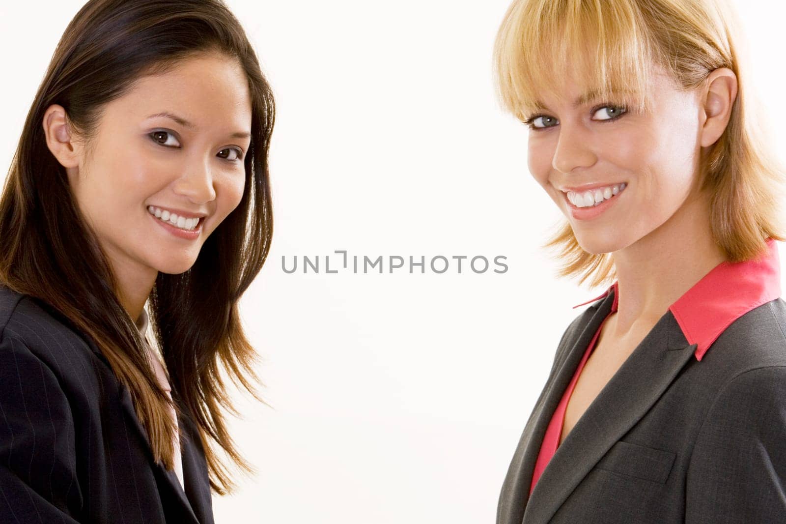 Portrait of two businesswomen smiling
