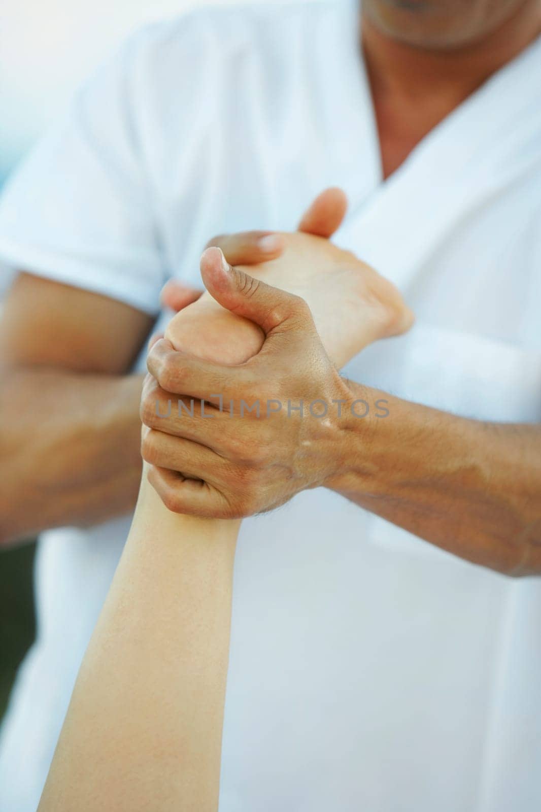 Close-up of a massage therapist massaging a personŽs leg