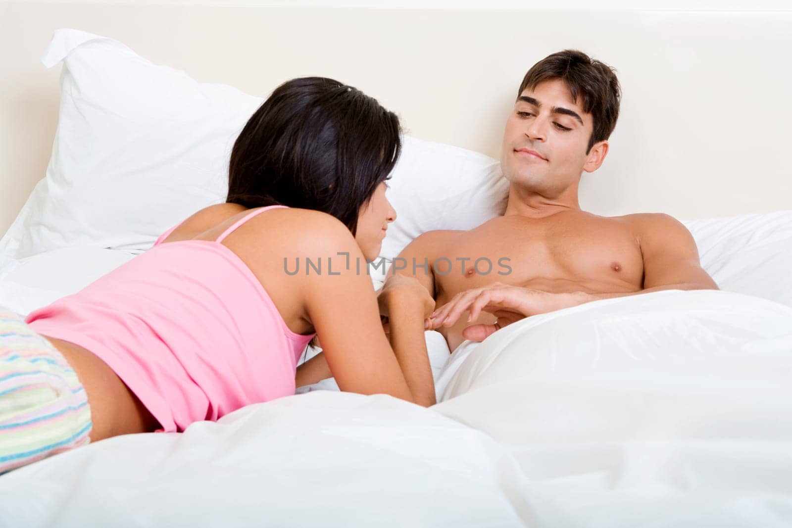 Young couple lying on the bed