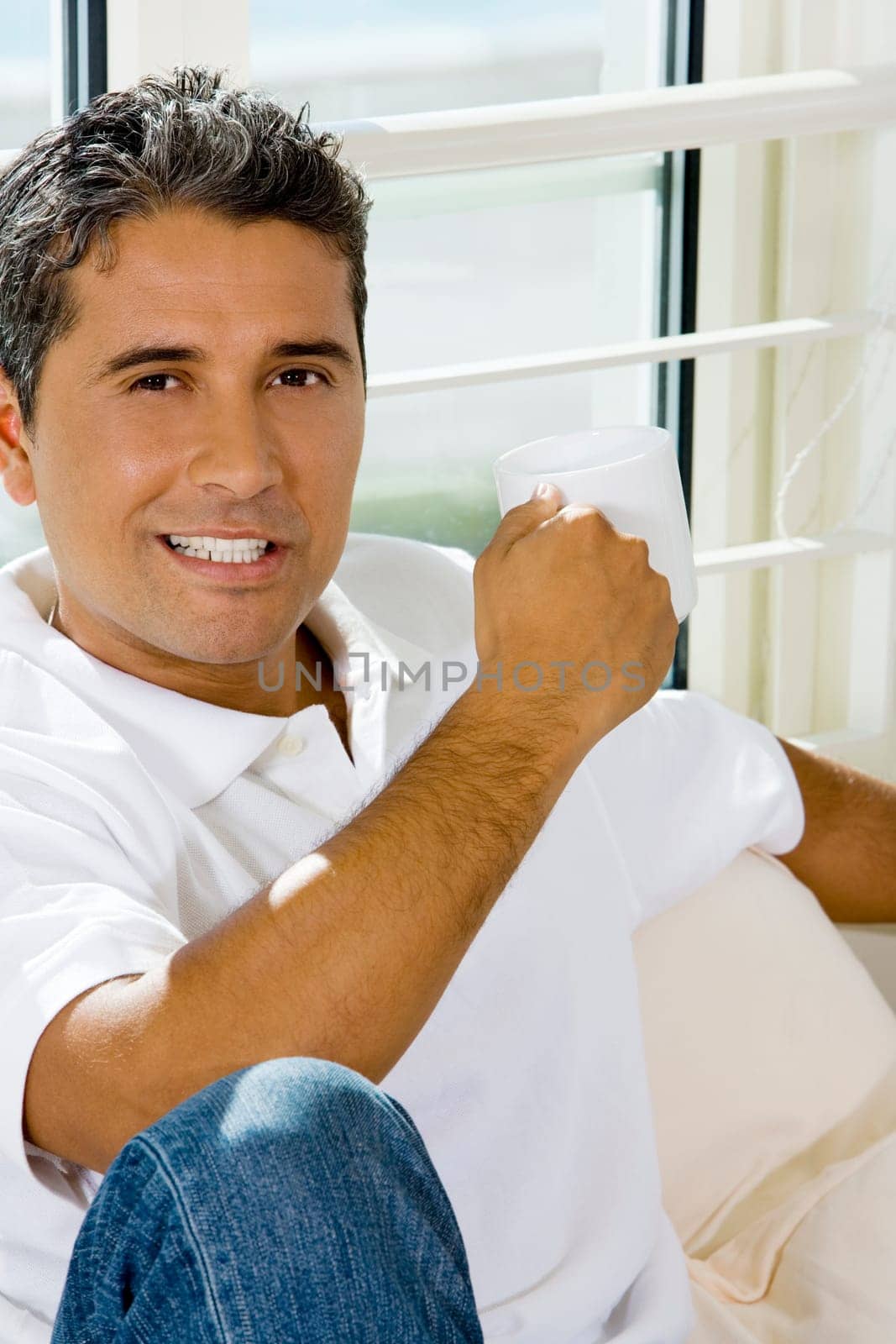 Portrait of a mid adult man holding a cup