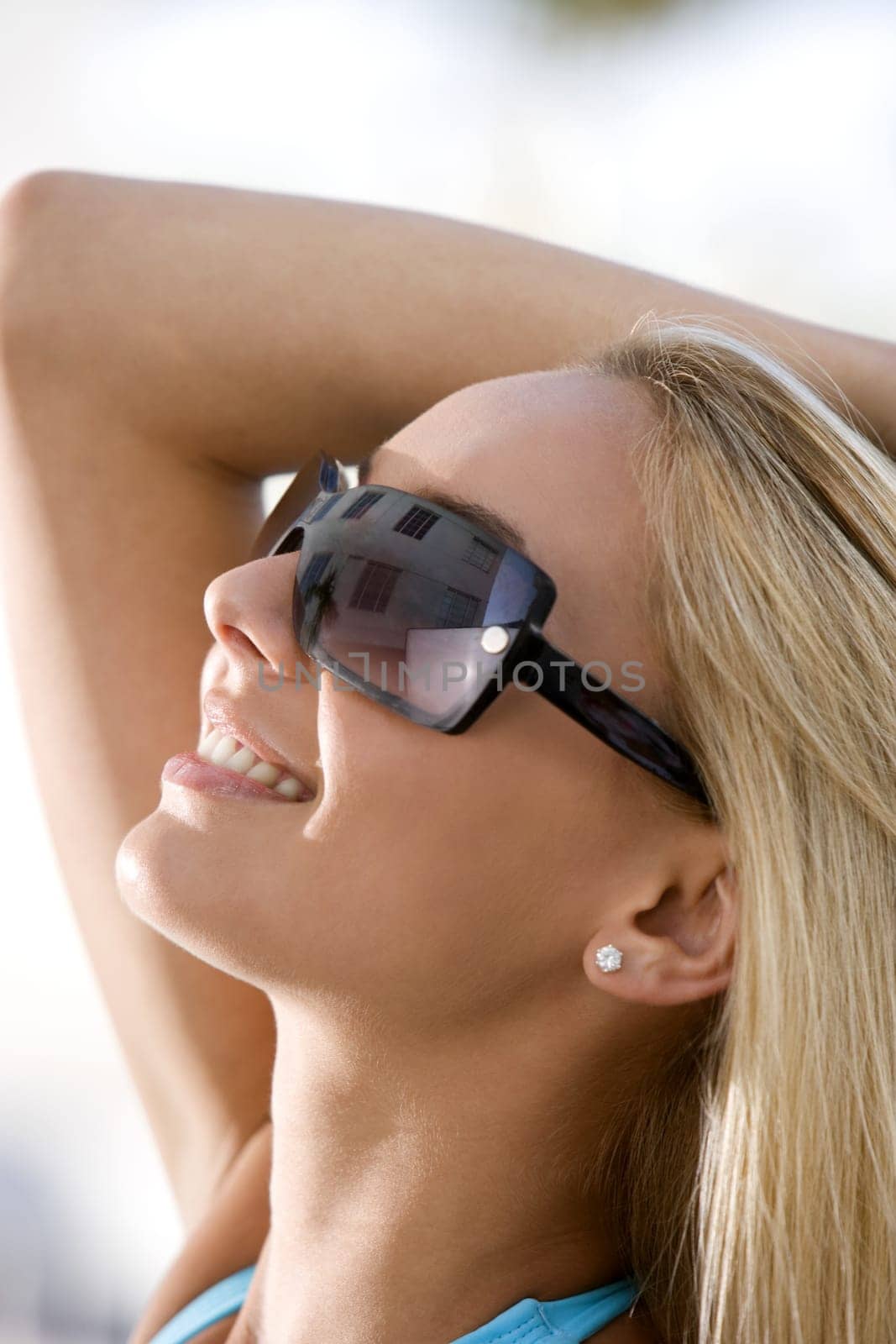 Close-up of a young woman wearing sunglasses