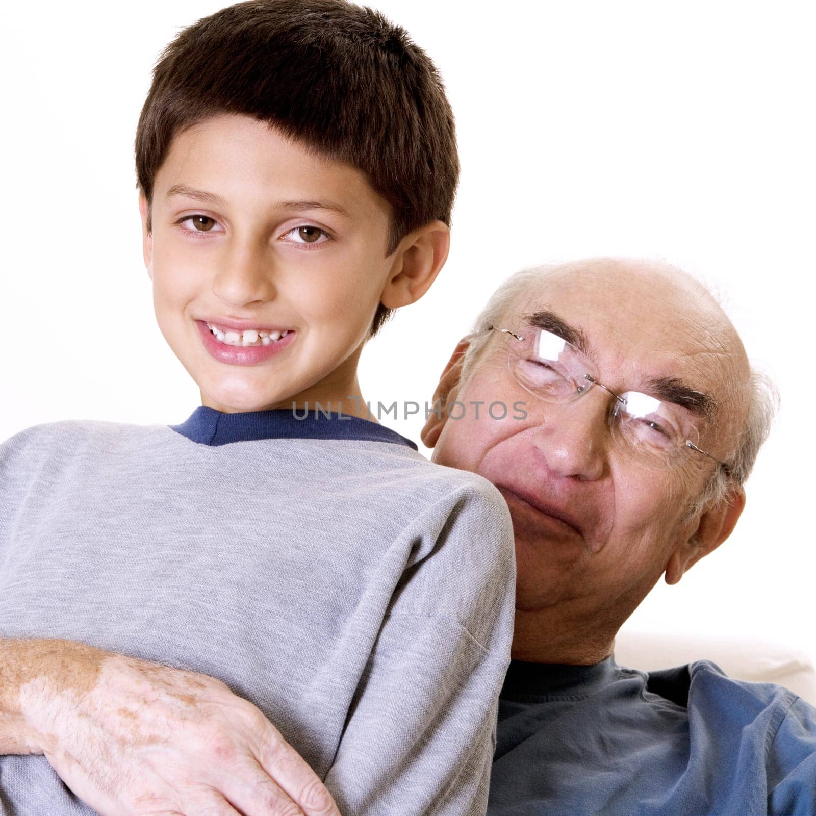 Portrait of a grandfather hugging his grandson