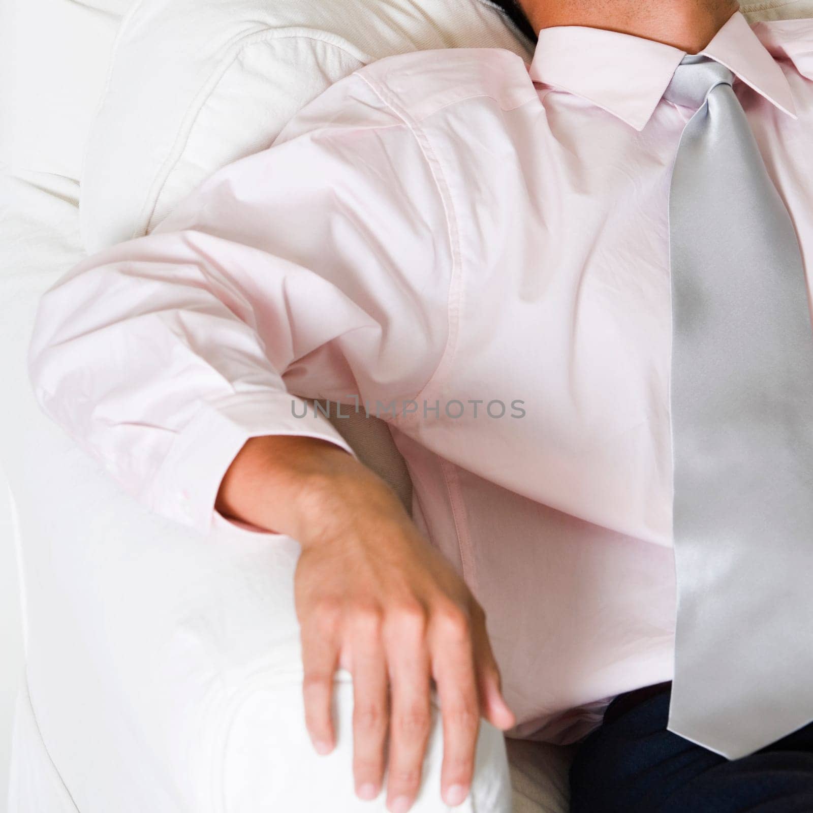 High angle view of a businessman sleeping in an armchair