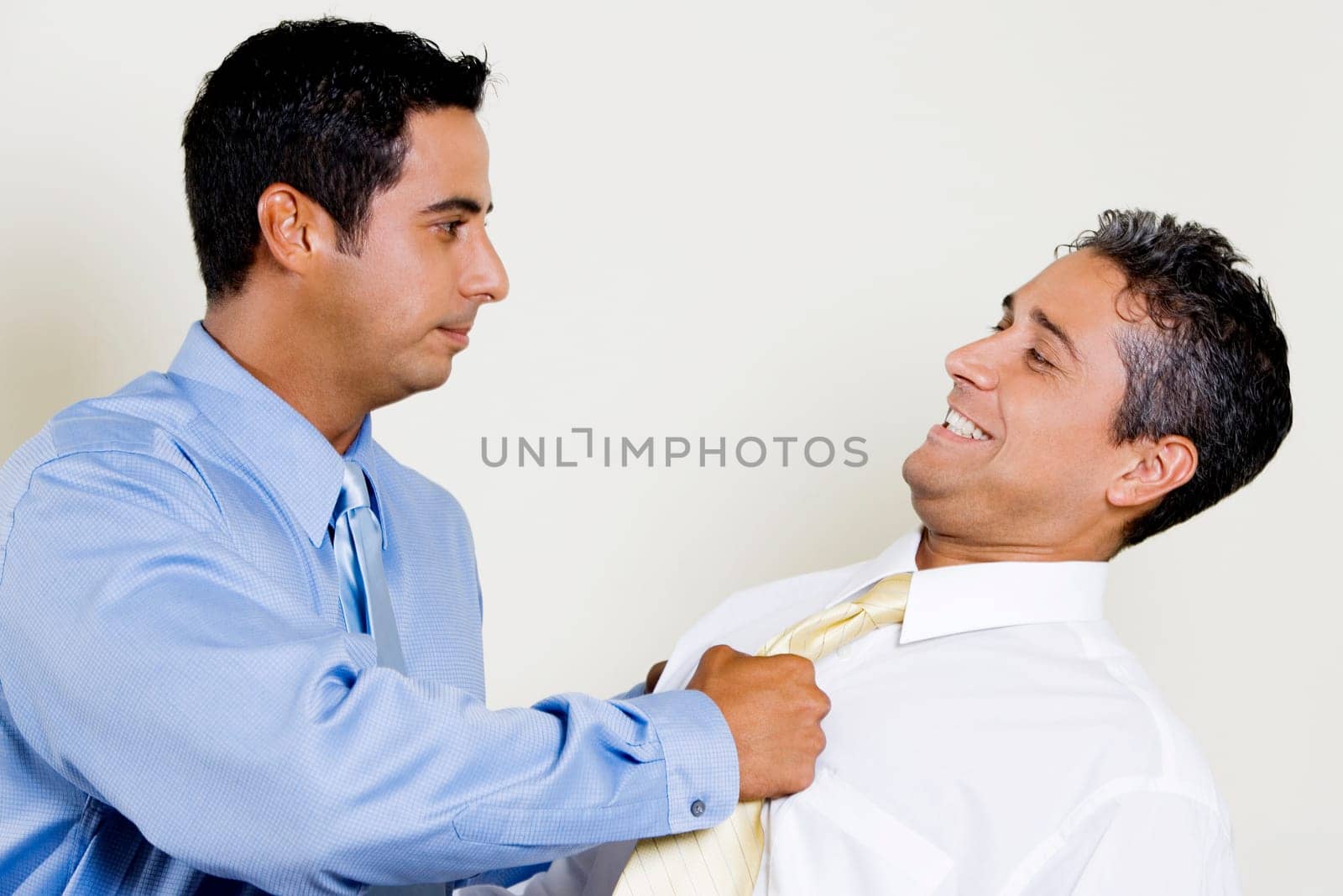 Businessman pulling his ColleagueŽs tie