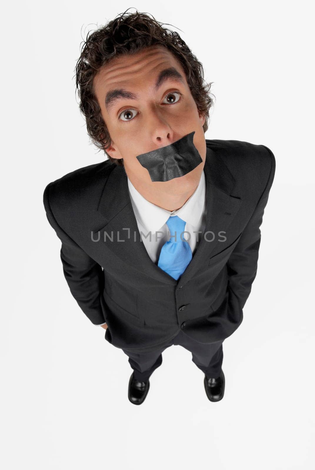High angle view of a businessman with duct tape on his mouth