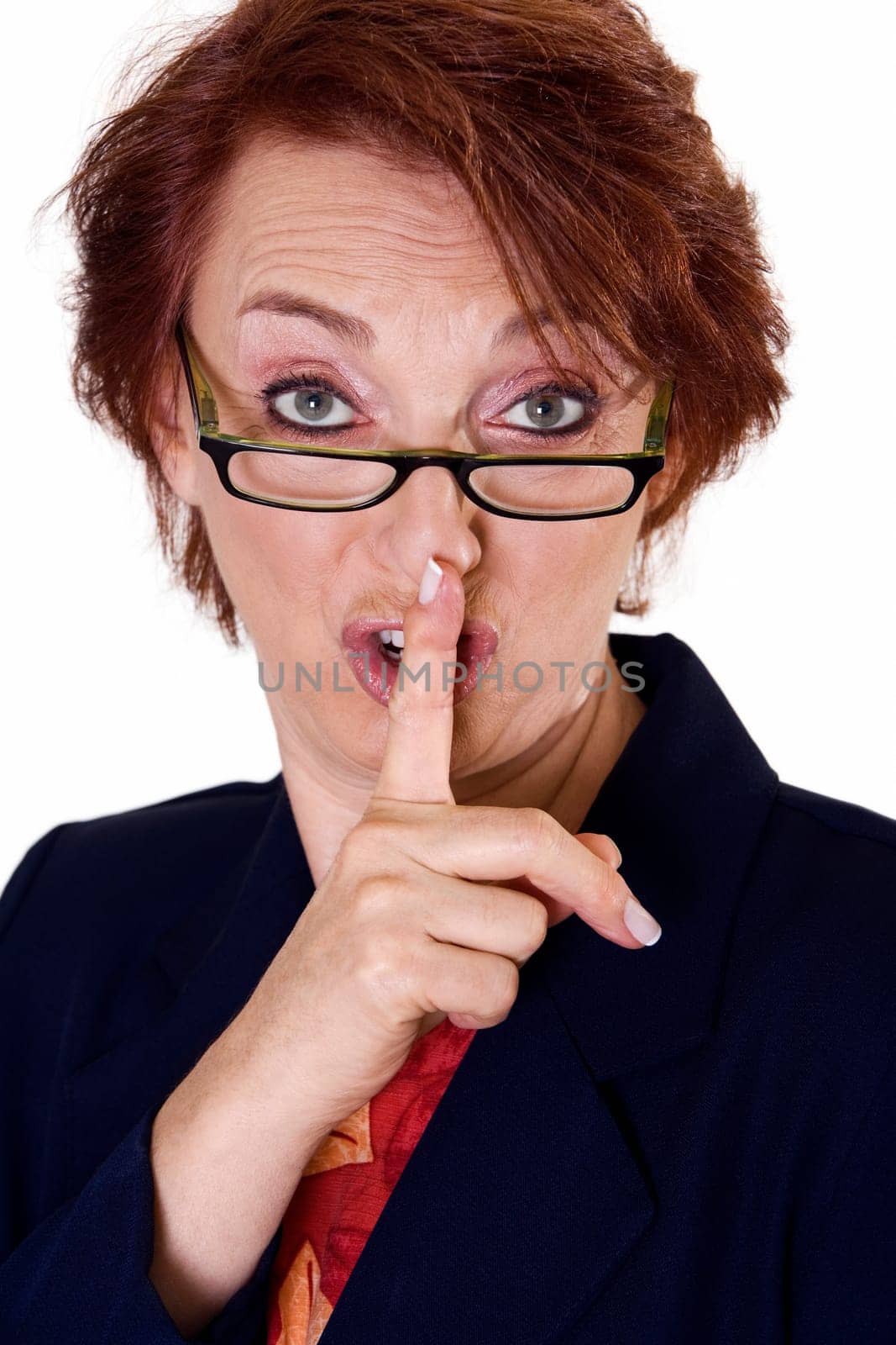 Portrait of a businesswoman with her finger on her lips