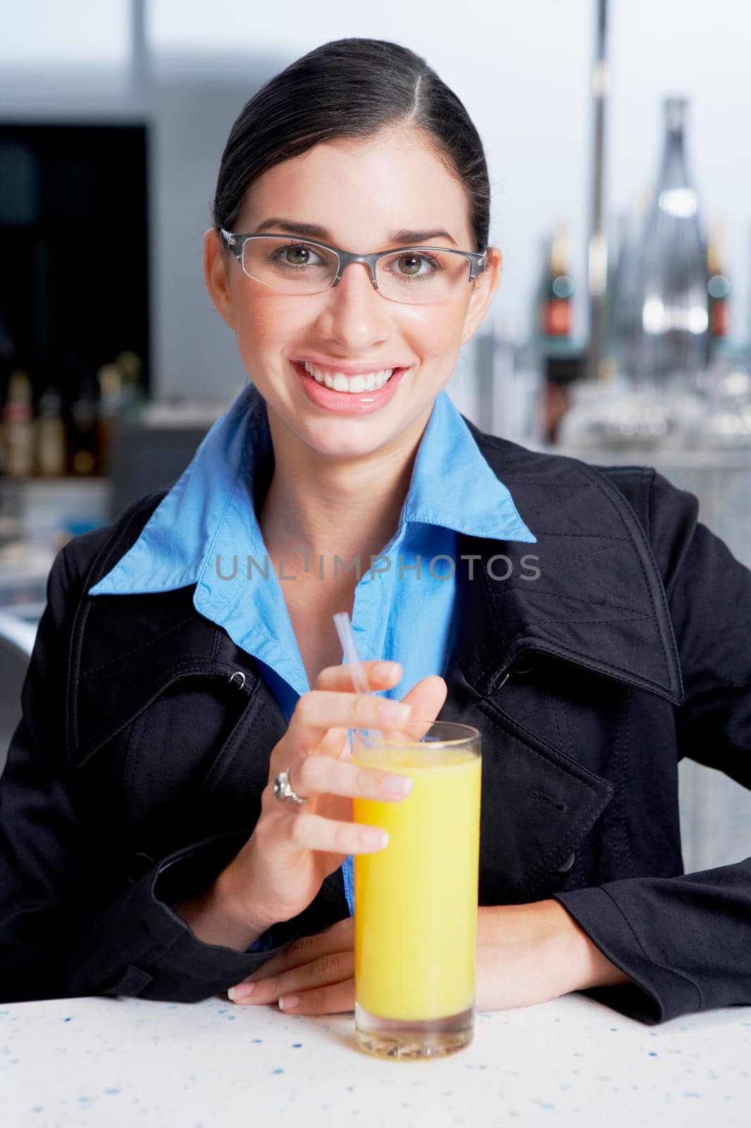 Portrait of a businesswoman with a glass of orange juice