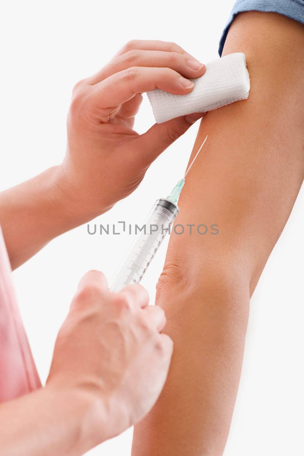 Close_up of a doctor giving injection to a patient