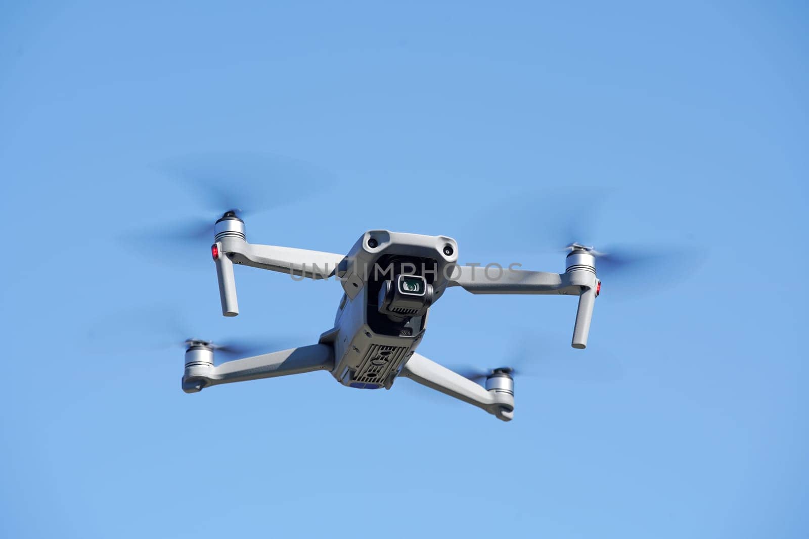 drone flying in air and clear blue sky background