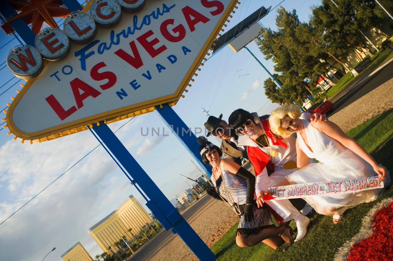Mid adult men and mid adult women dressed in costumes, Las Vegas, Nevada, USA