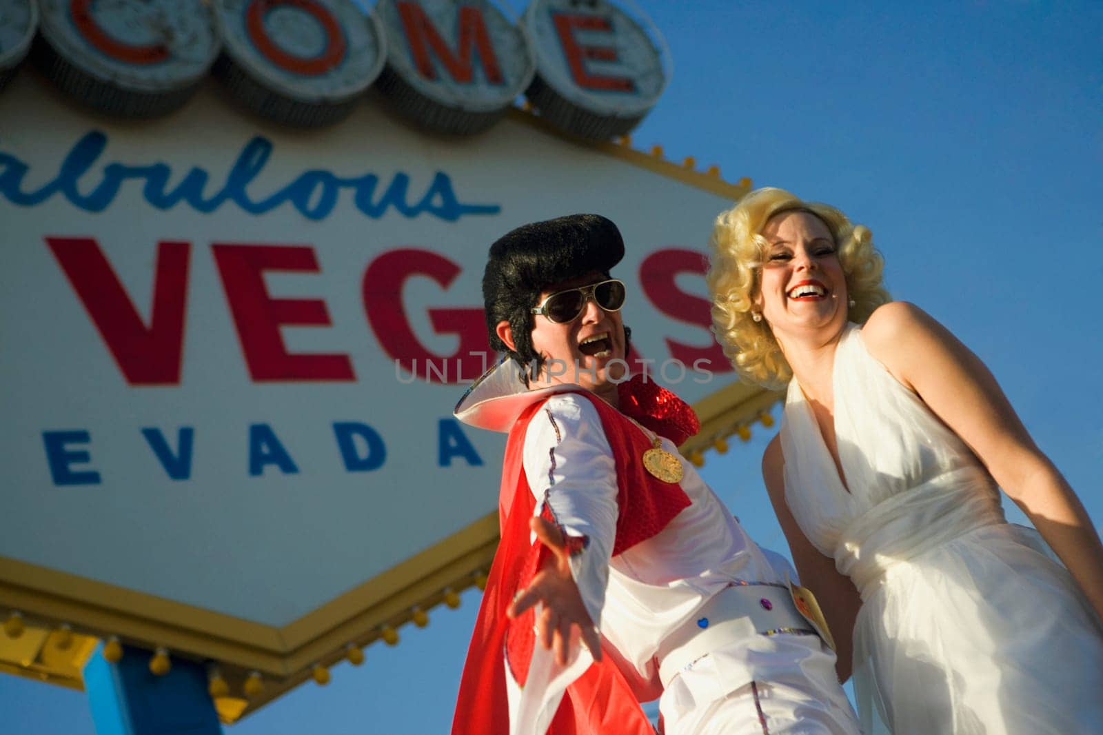 Mid adult man and a mid adult woman dressed in costumes, Las Vegas, Nevada, USA