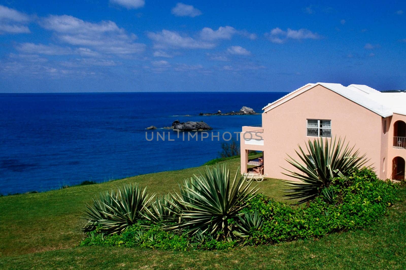 Side view of a pink building facing the ocean, Devonshire north shore, Bermuda