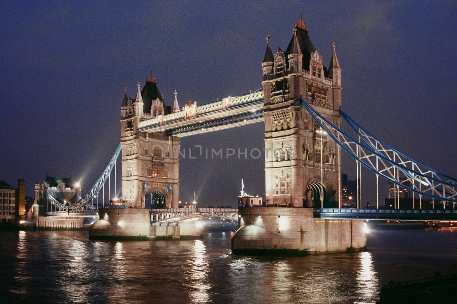 Low angle view of Tower bridge at night, London, England