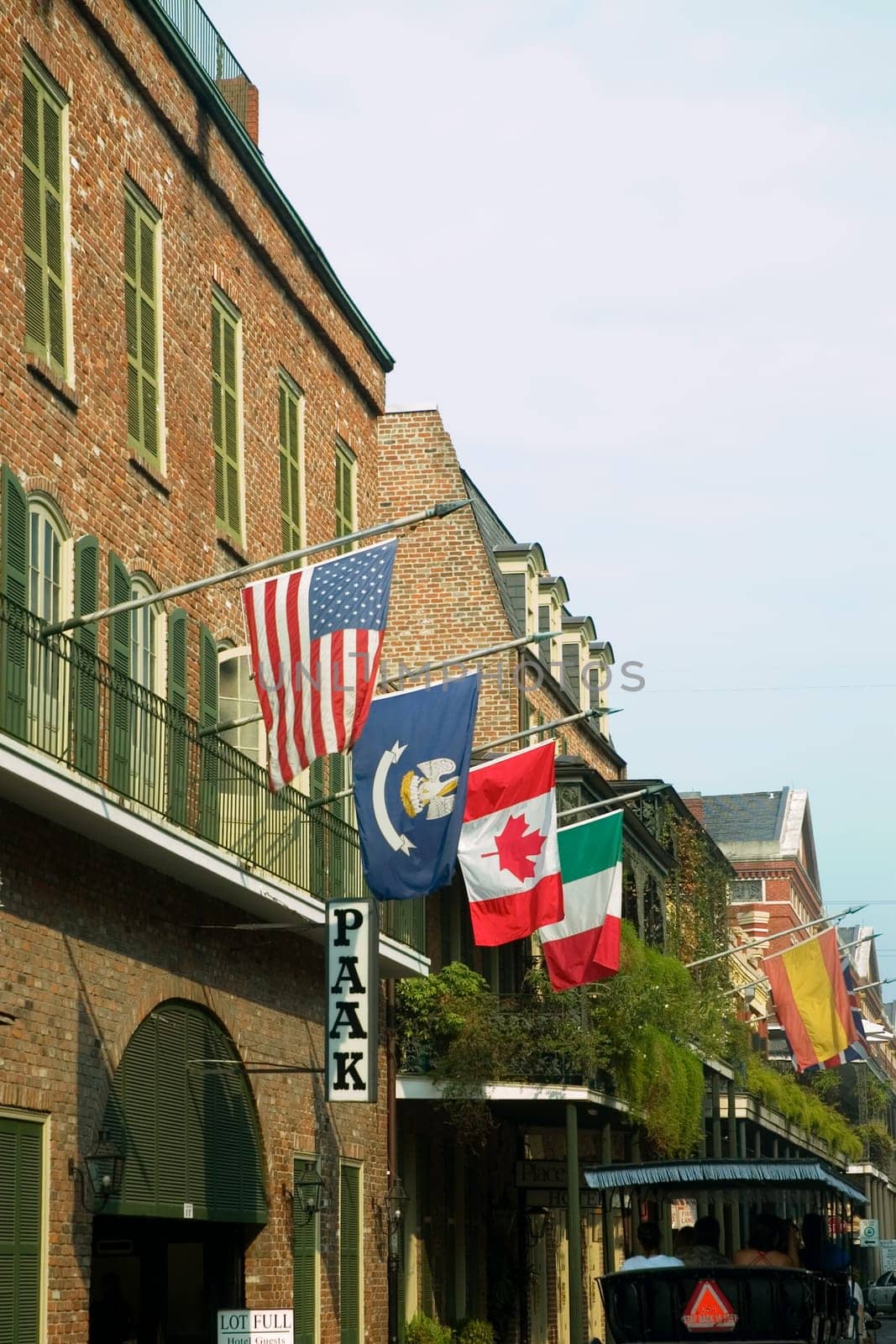 National flags on balconies of buildings, New Orleans, Louisiana, USA