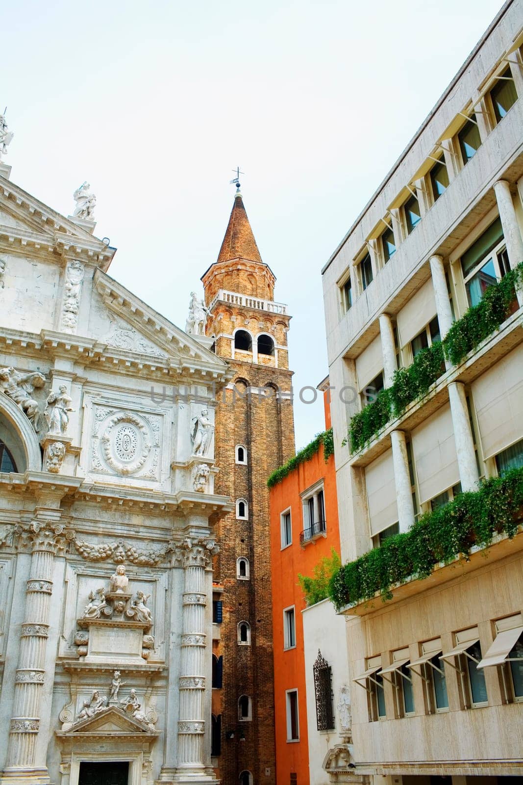 Low angle view of the bell tower and a church, Venice, Italy