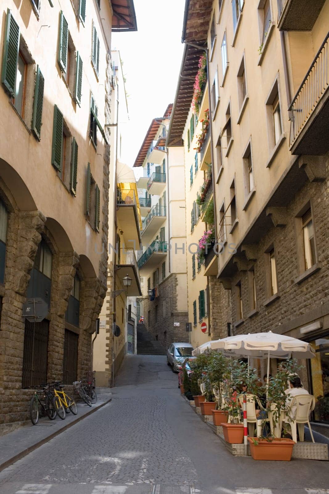Two people in a sidewalk cafe, Florence, Italy