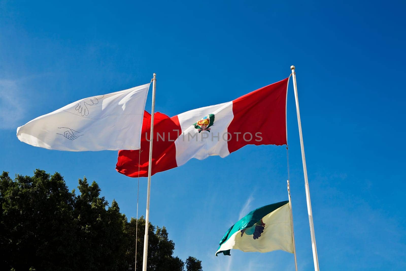 Low angle view of flags fluttering, Plaza-De-Armas, Pisco, Ica Region, Peru