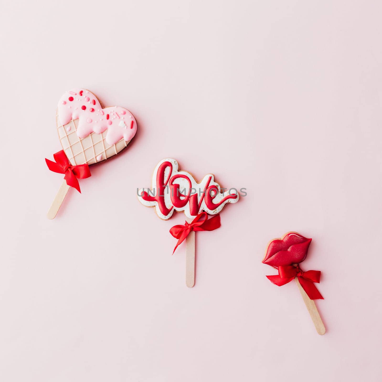 Gingerbread cookies love, lips, heart ice cream. Valentine card. Pink background. High quality photo