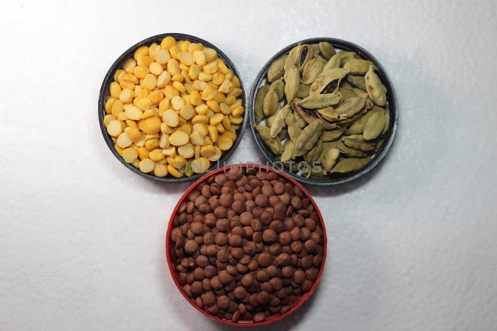 Top view of assortment of cereals, and cardamom. Collection of different spices and cereals.