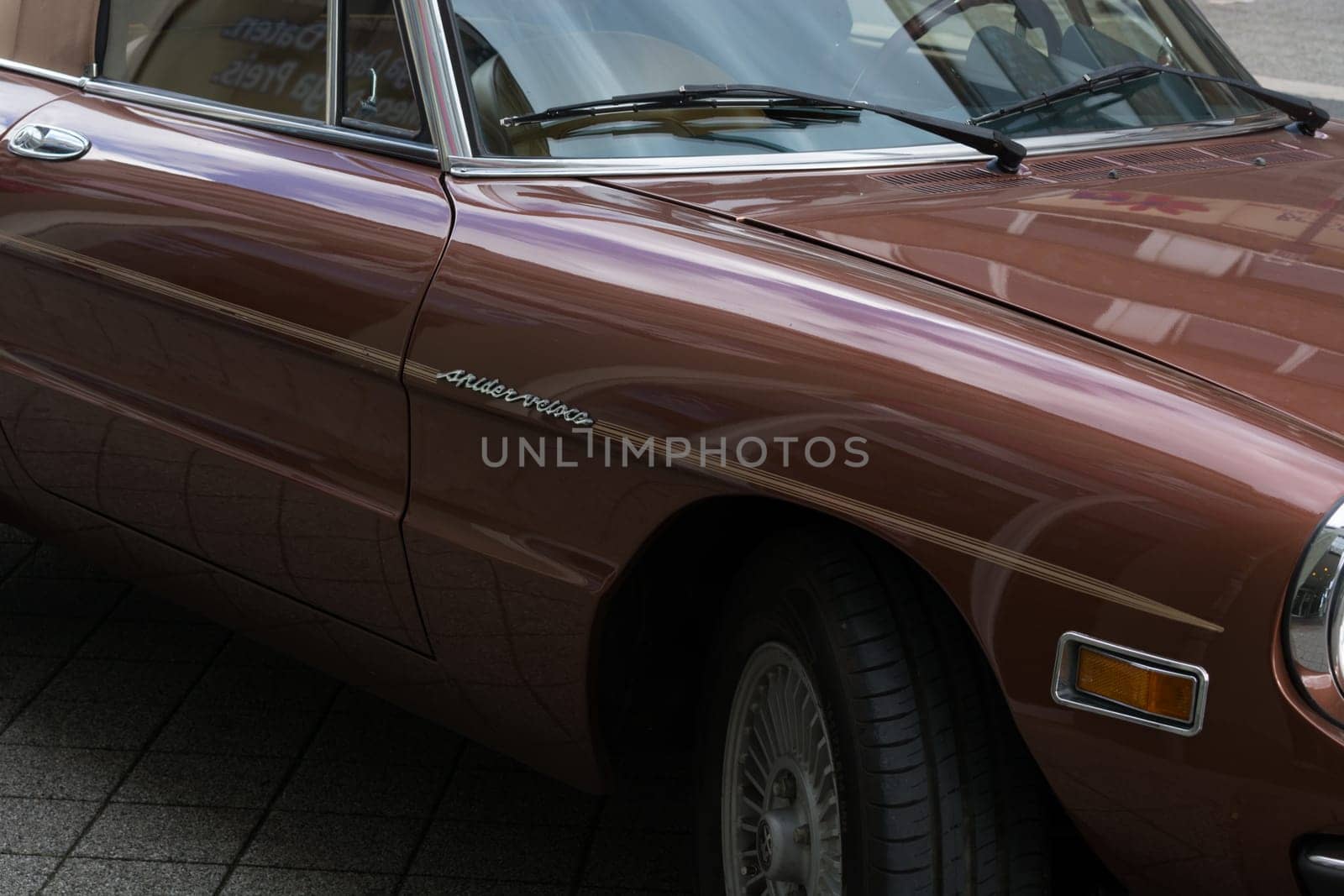 HEILIGENHAUS, NRW, GERMANY - SEPTEMBER 10, 2017:..Alfa Romeo Spider Side view in dark red color, parked in Heiligenhaus, Deutschland.