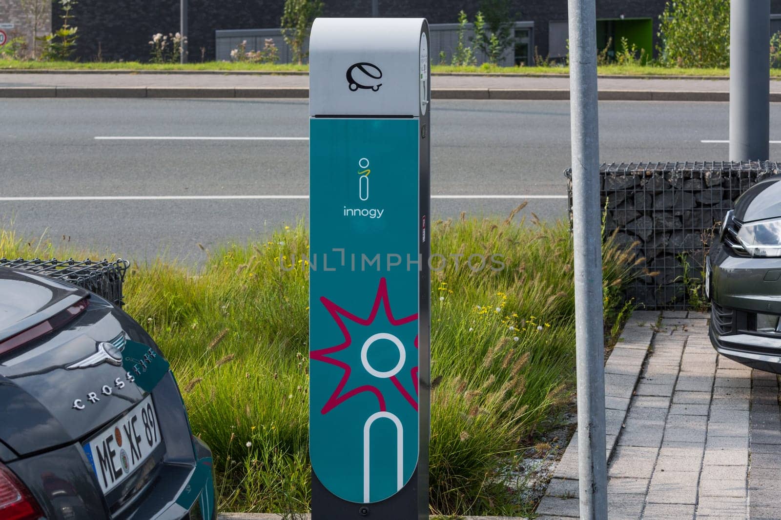HEILIGENHAUS, NRW, GERMANY - AUGUST 24, 2017:...Parking in Heiligenhaus charging of modern electric car on the road is the future of the automobile.