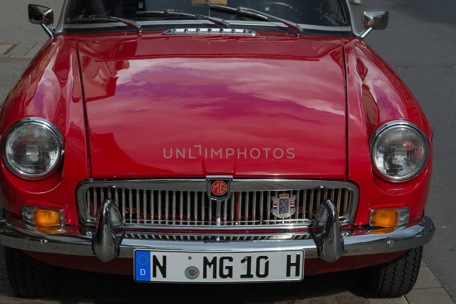 HEILIGENHAUS, NRW, GERMANY - SEPTEMBER 10, 2017:..Oldtimer Morris Garages Model MGB front view in  red color, parked in Heiligenhaus, Deutschland.