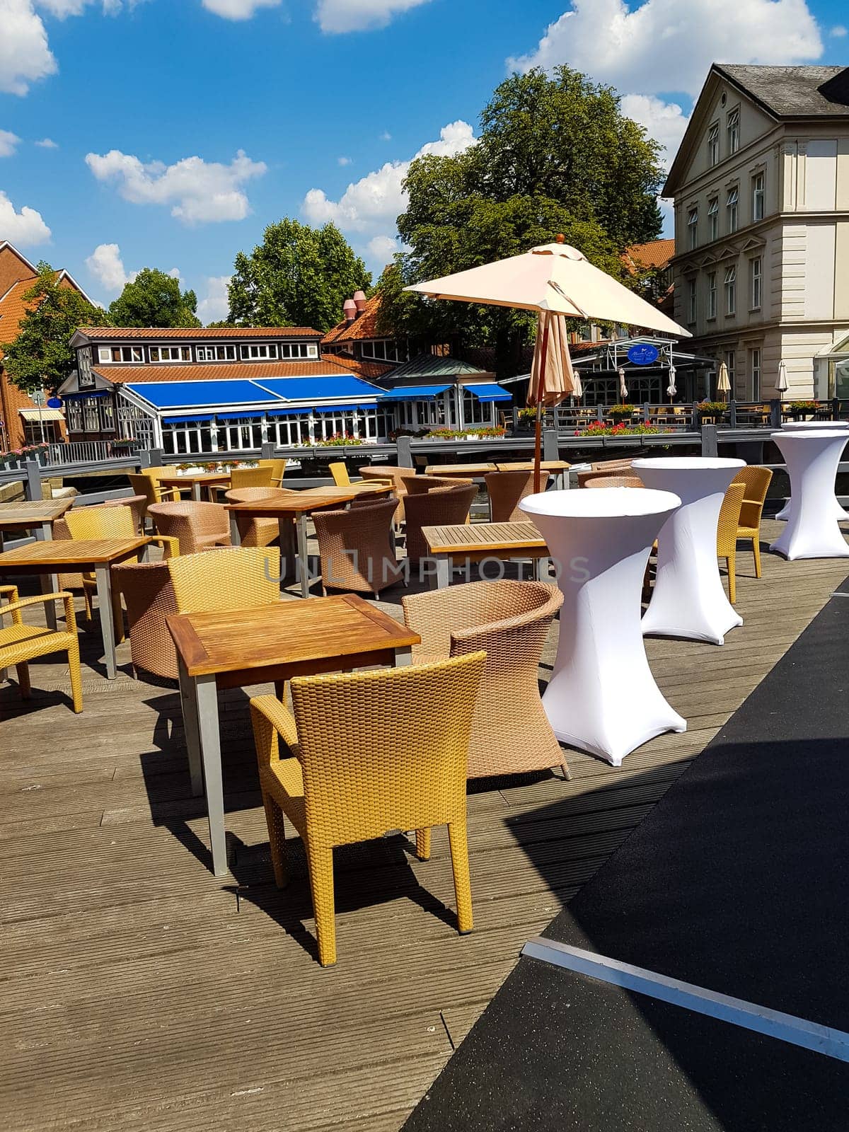 LÜNEBURG, NIEDERSACHSEN, GERMANY - JULI 27, 2018:.Restaurant Terrace in the center of the city Lüneburg in the background you can see the Romantik Hotel Bergström in the historic center of Lüneburg.