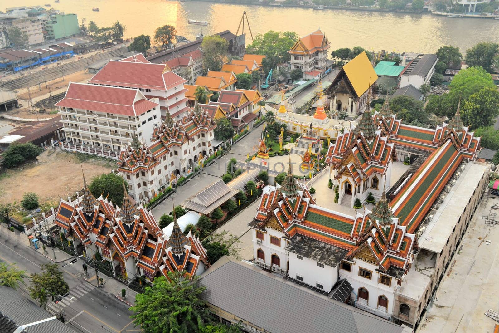 Aerial view of Wat Suthiwararam Buddhist temple from abandoned skyscraper Sathorn Unique, Bangkok, Thailand