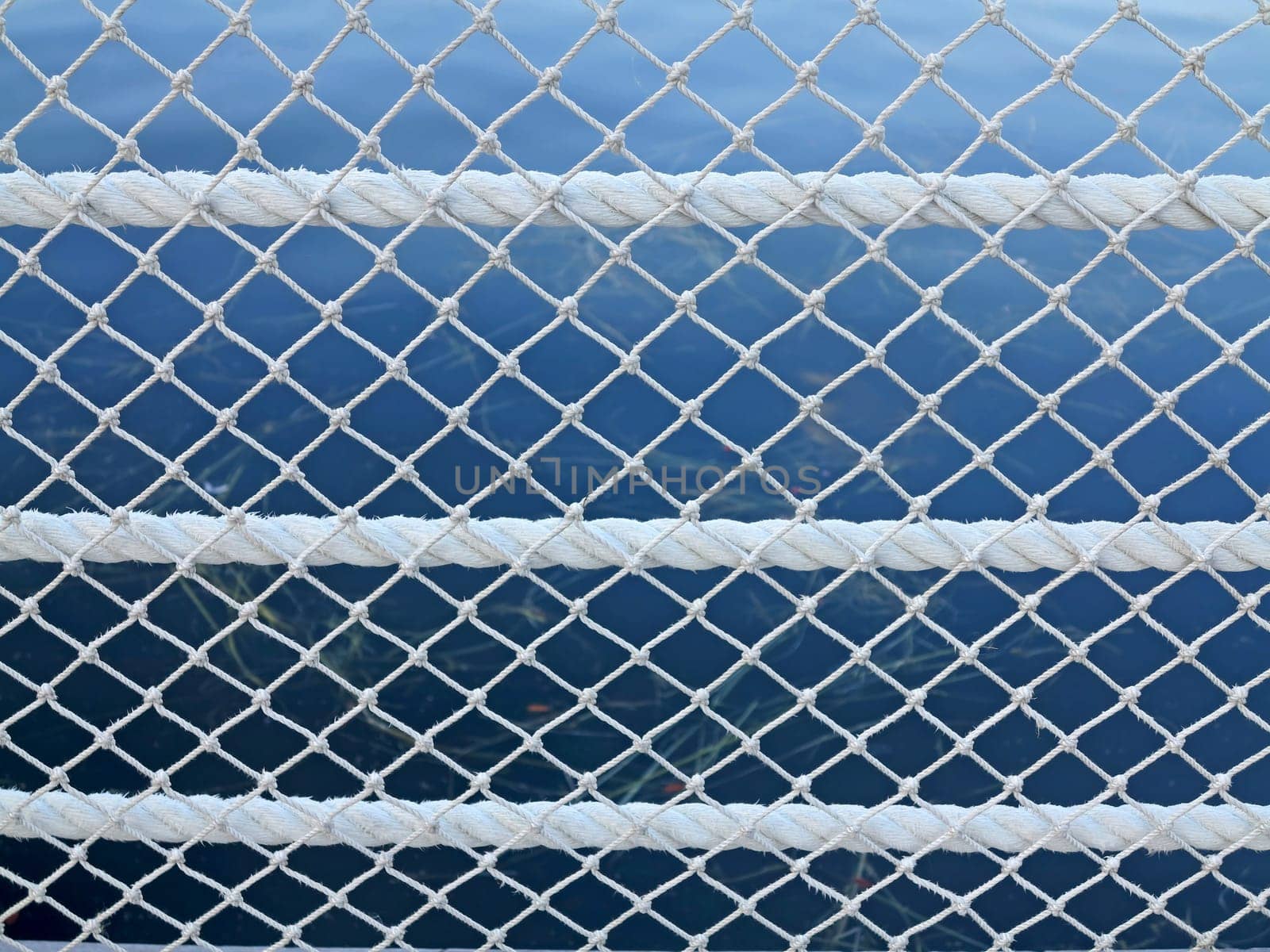 Rope and Net pattern with a lake behind
