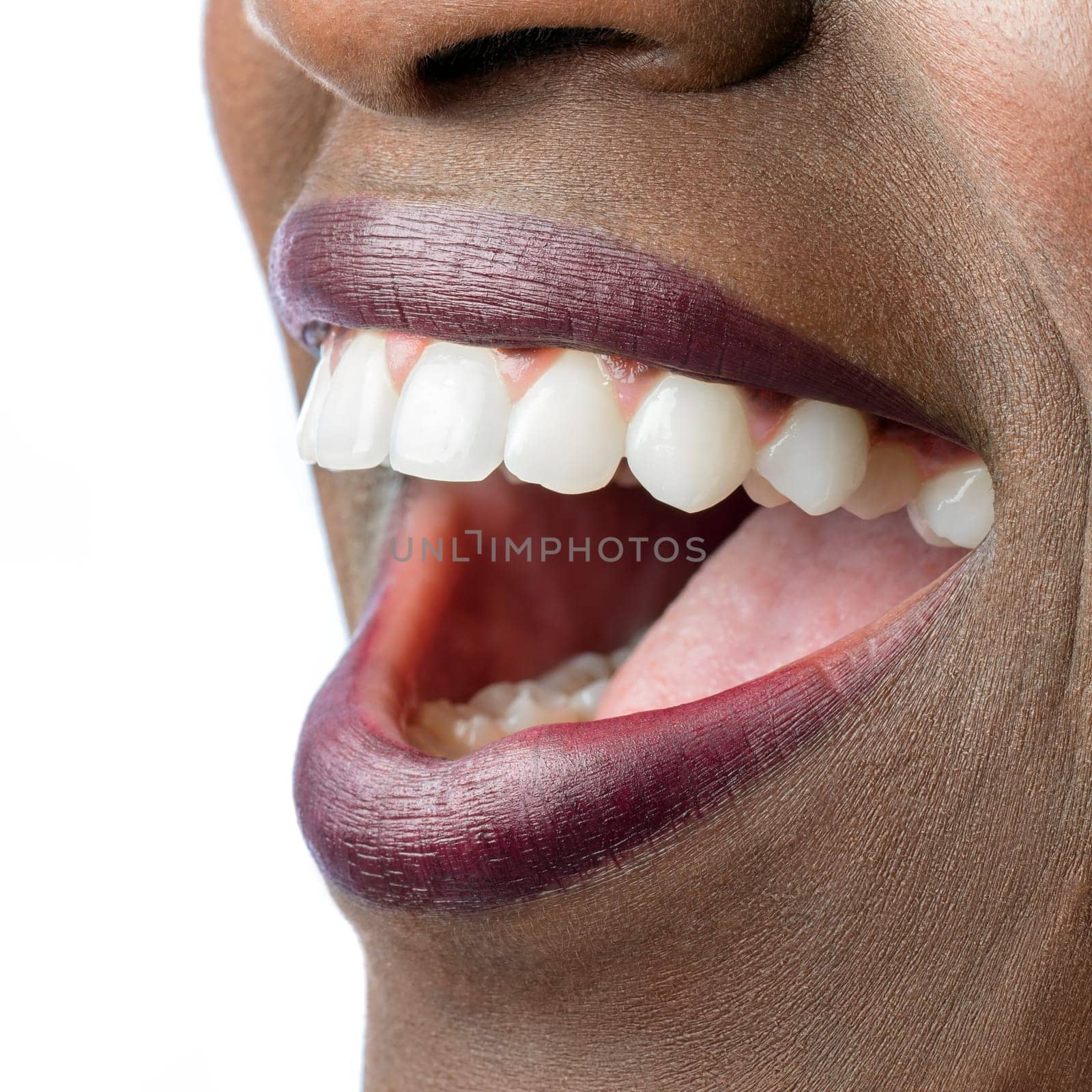 Macro close up of African female mouth. Open mouth showing perfect white teeth isolated on white background.