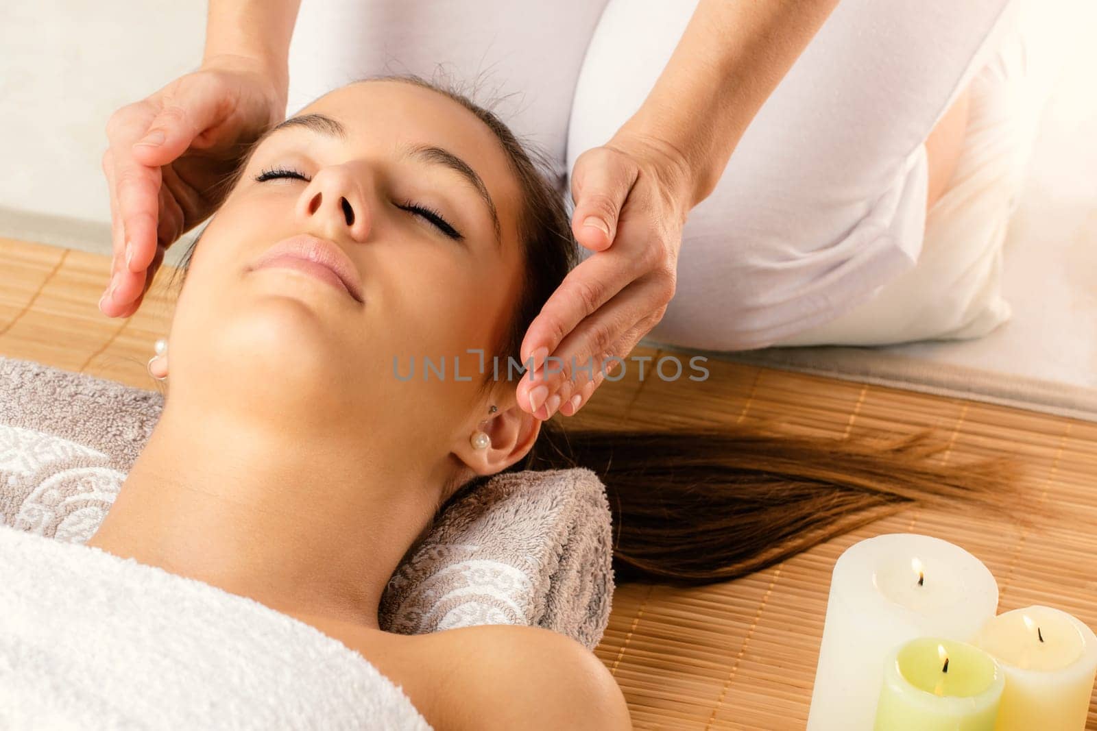 Close up portrait of attractive woman at alternative therapy session.