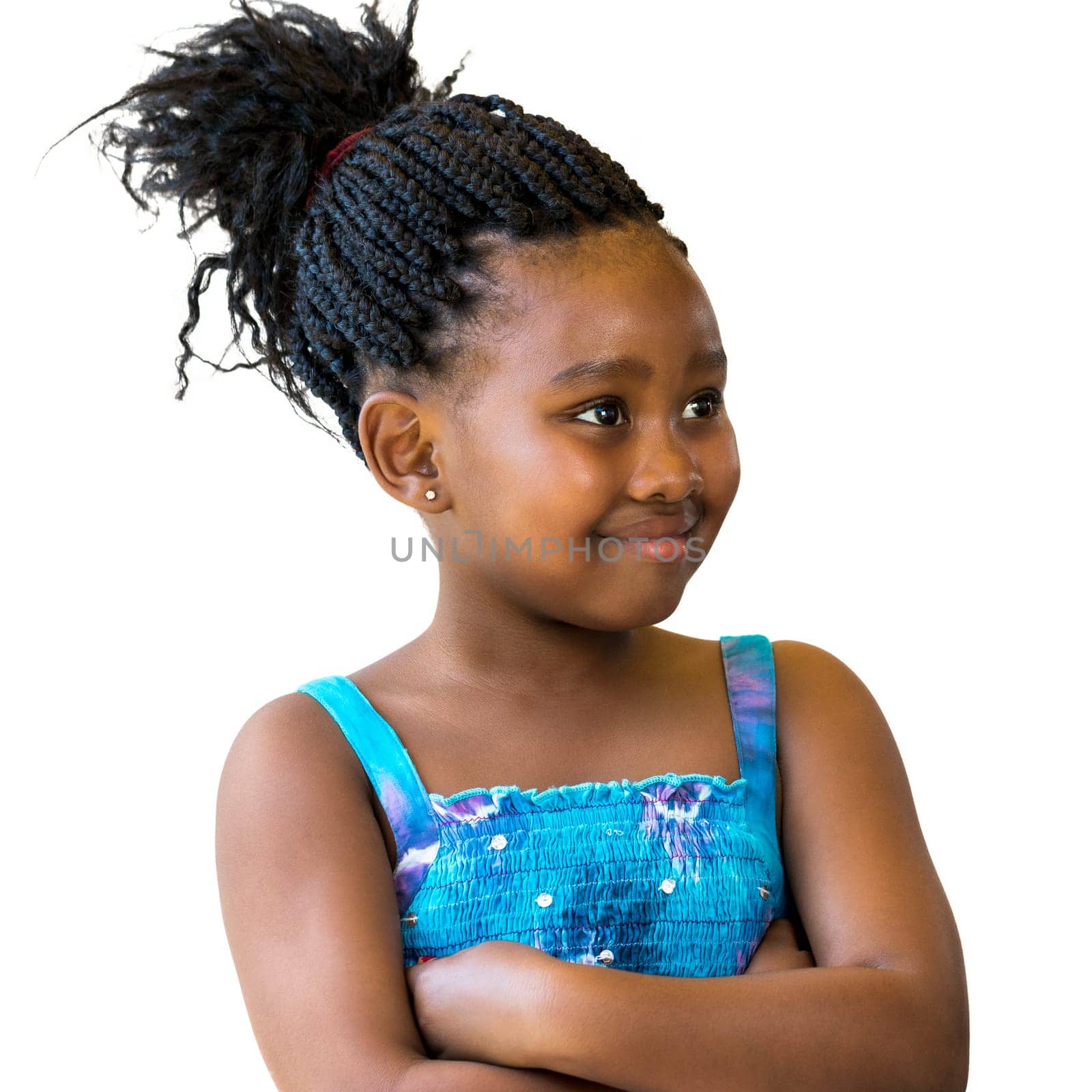 Close up portrait of little african girl with braided hair looking aside.Isolated against white background.