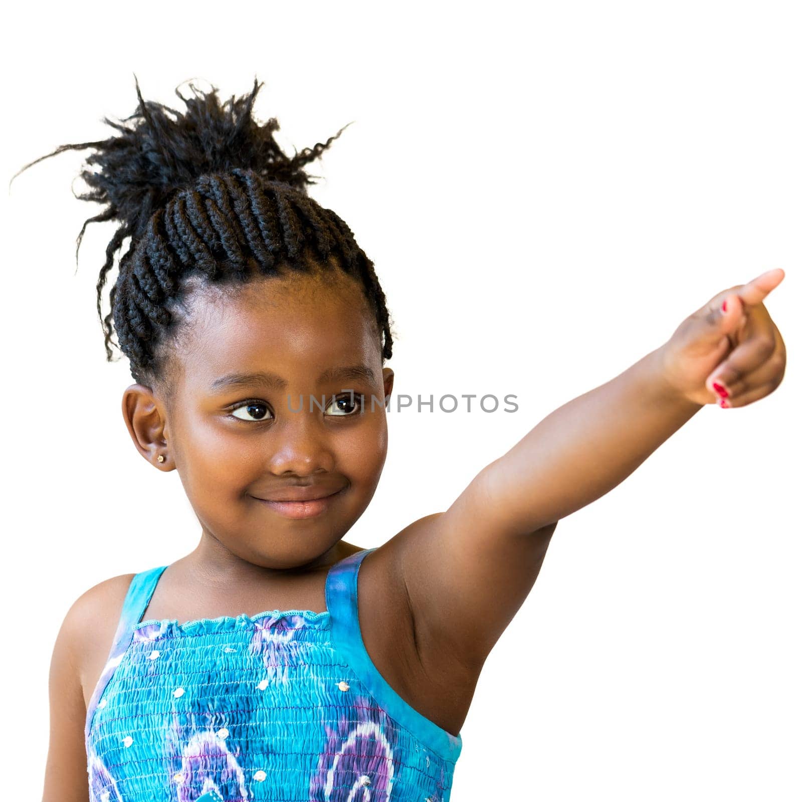 Close up portrait of cute african girl with braided hair pointing with finger at corner.Isolated on white background..