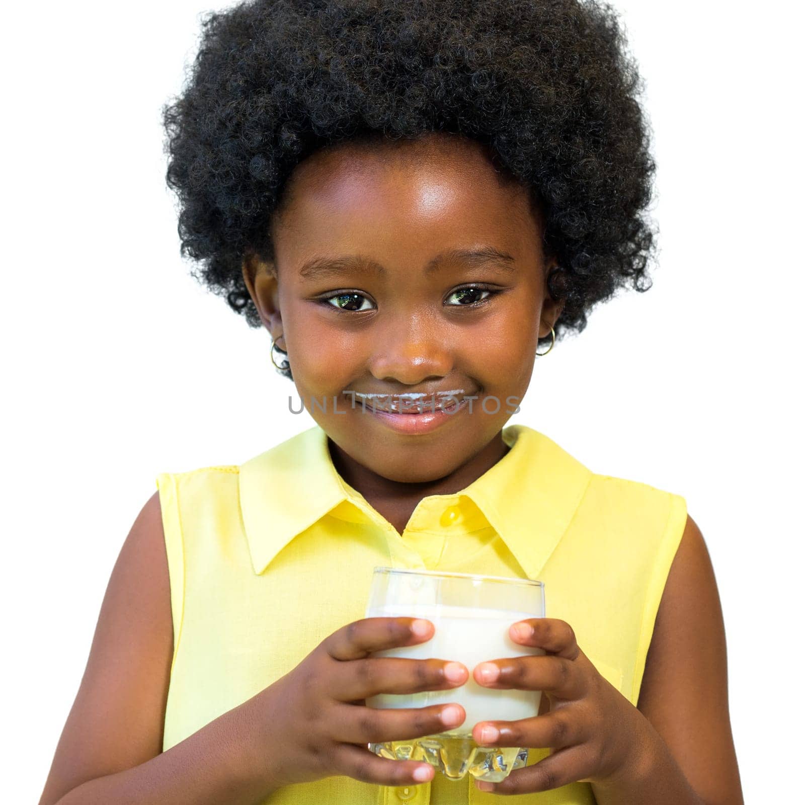 Close up portrait of little black girl holding glass of milk.Kid with afro hairstyle Isolated on white background.