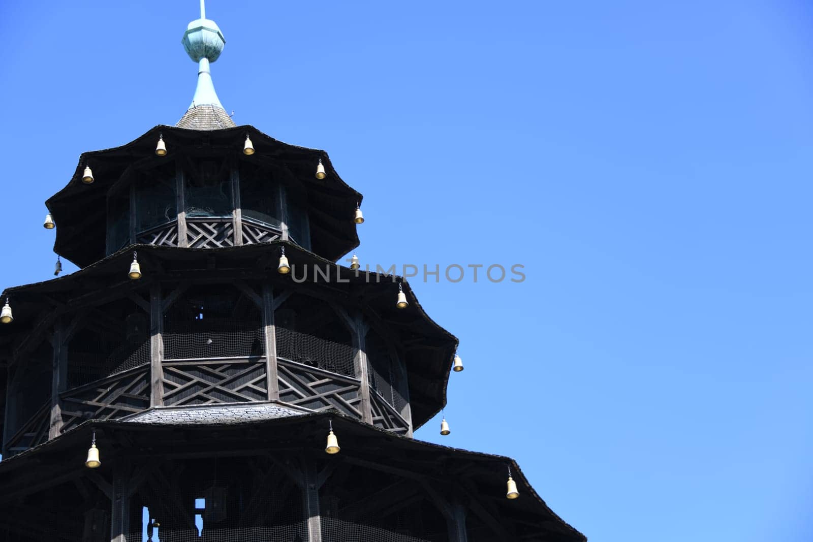 The top of the Chinese Tower in Munich in the English Garden. It was built between 1789 and 1790. Kochelball folk dance sight beer garden landmark pagoda beer bench concert Schwabing architectural style China tower city tour Bavaria Europe