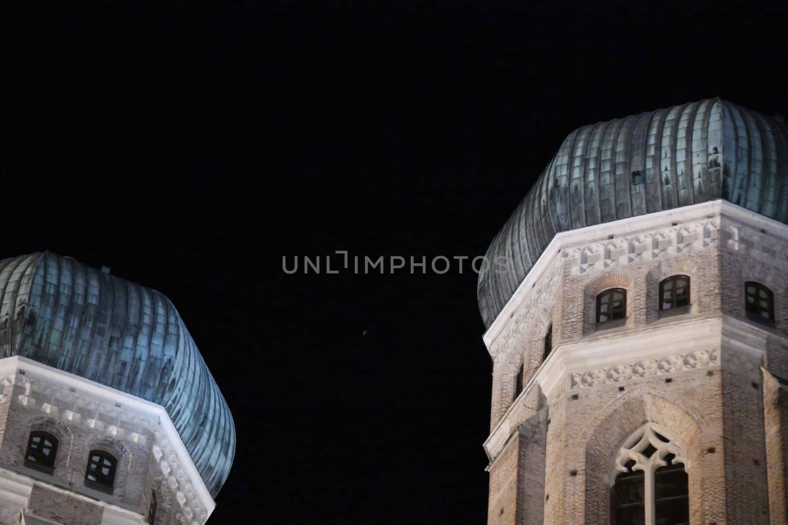 The Welschen Hauben of the Frauenkirche in Munich in the evening. Munich Bavaria Archbishop Freising Landmark Church Tower Towers Gothic sight Catholic onion domes Cathedral of Our Lady Top 10 Women's Square