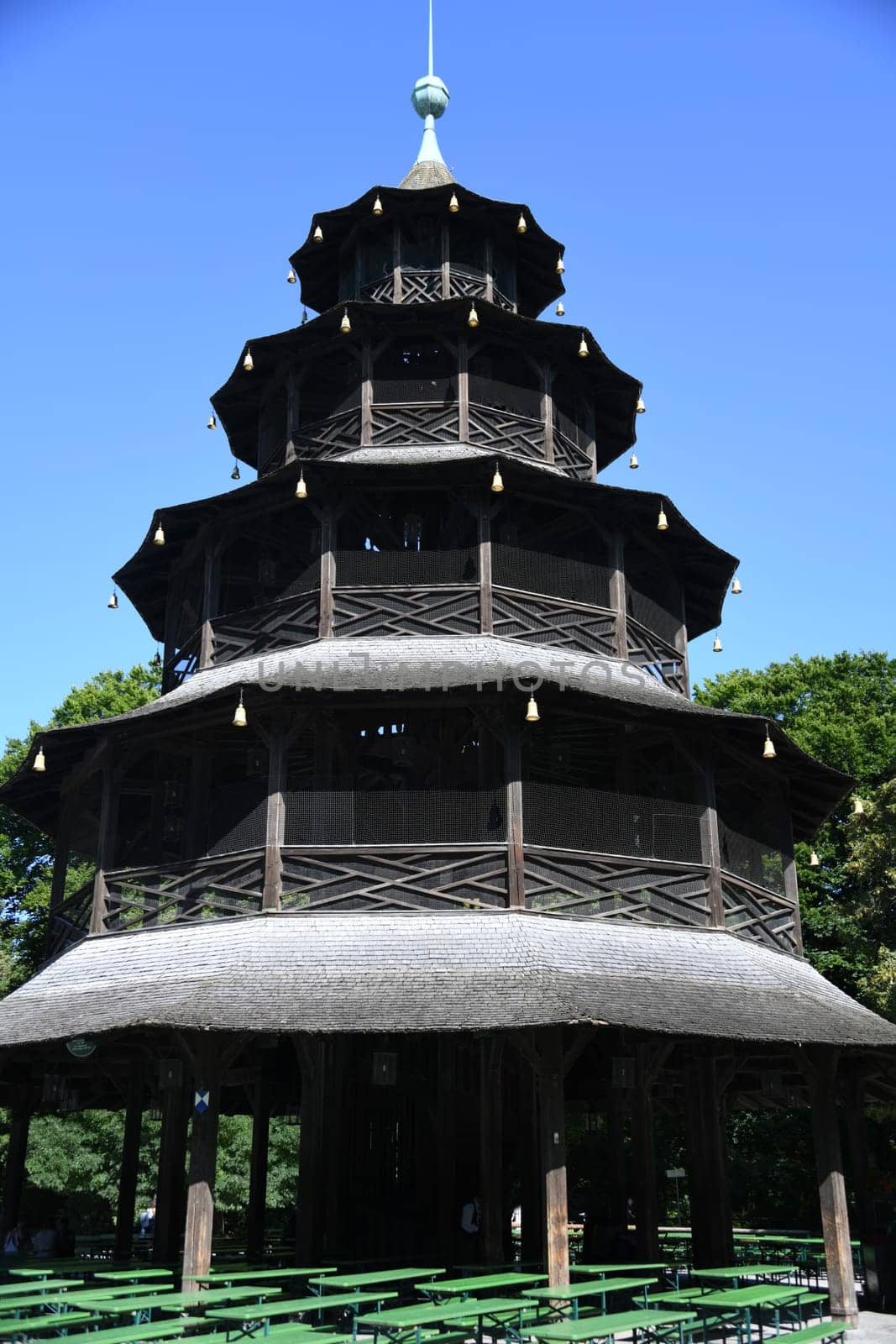 The Chinese Tower in Munich in the English Garden was built between 1789 and 1790. Kochelball folk dance sight beer garden landmark pagoda beer bench concert Schwabing architectural style China tower city tour Bavaria Germany