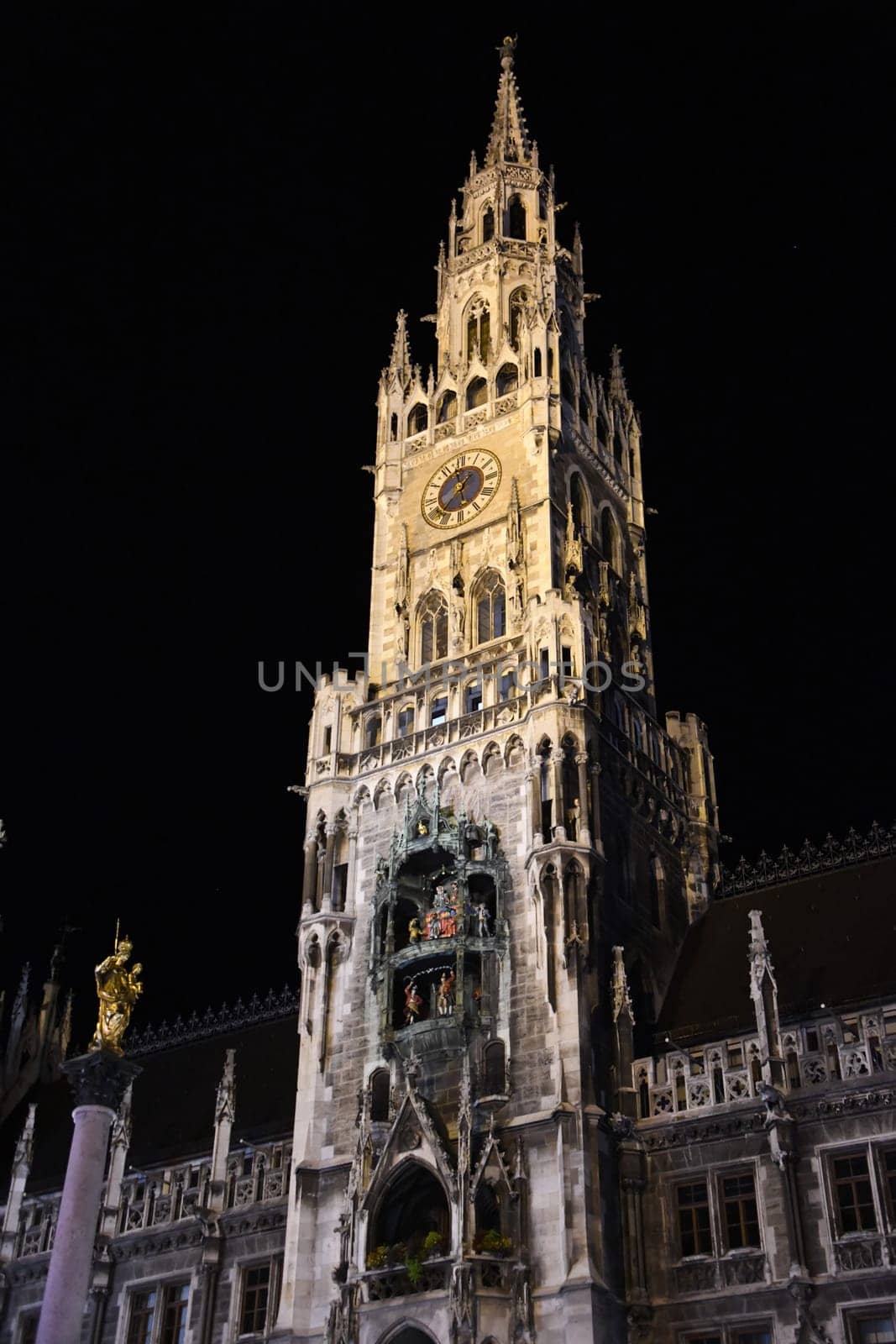 The town hall tower of the neo-Gothic New Town Hall in the Bavarian capital Munich with the famous Schäfflertanz and Glockenspiel at Marienplatz.