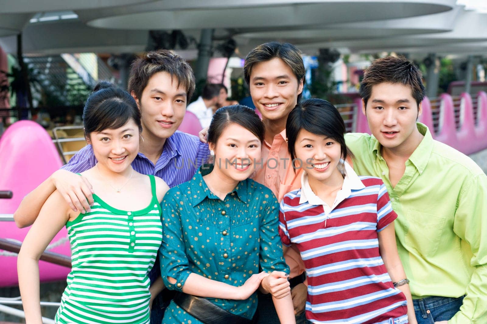 Portrait of a group of people standing together and smiling