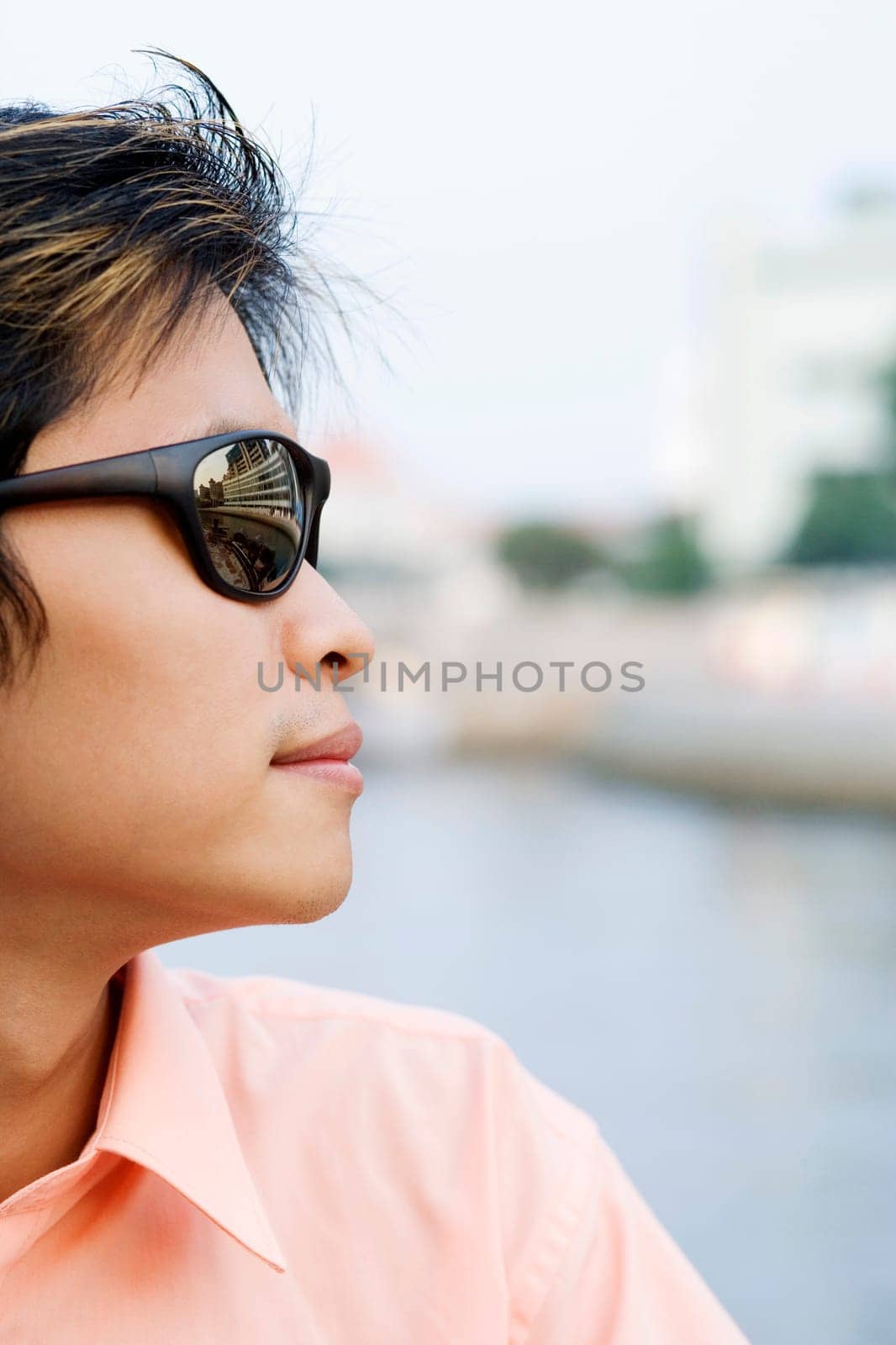 Close-up of a young man wearing sunglasses