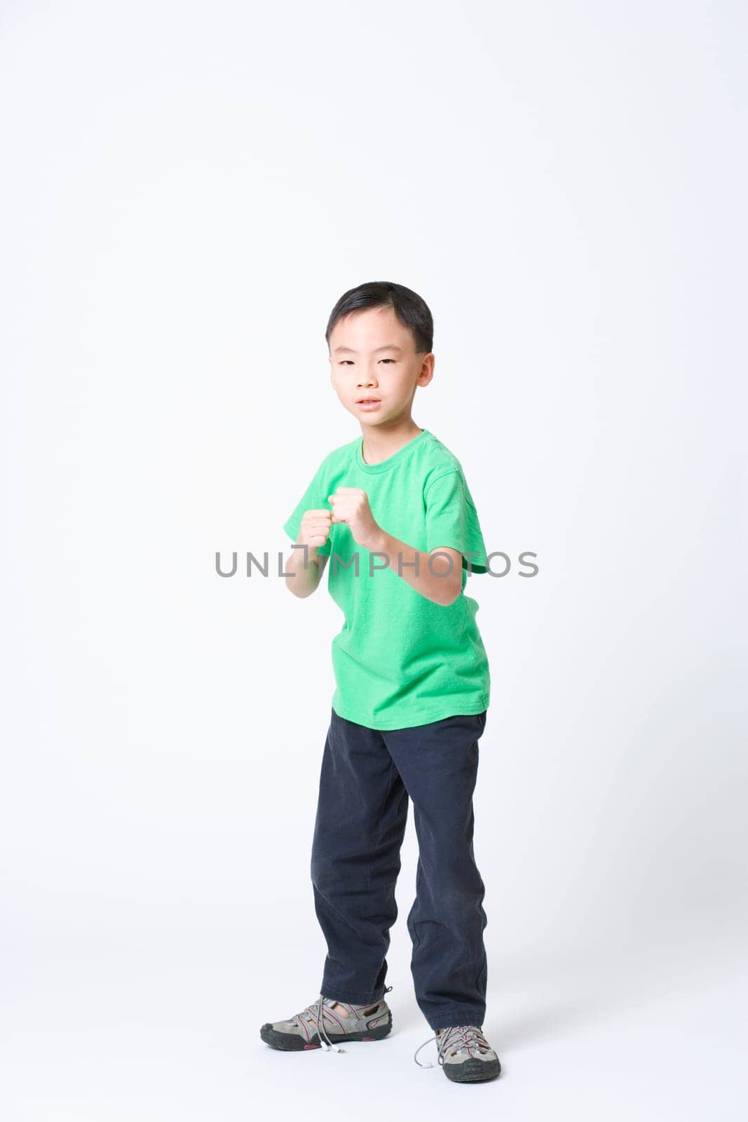 Portrait of a boy in a fighting stance