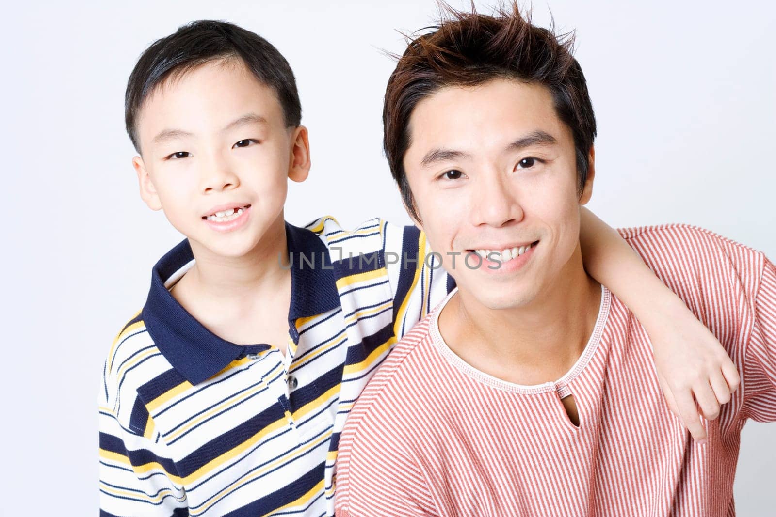 Portrait of a mid adult man smiling with his son