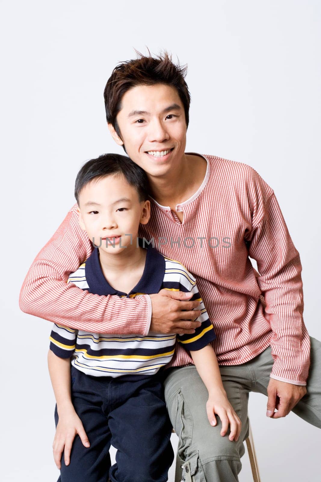 Portrait of a mid adult man smiling with his son