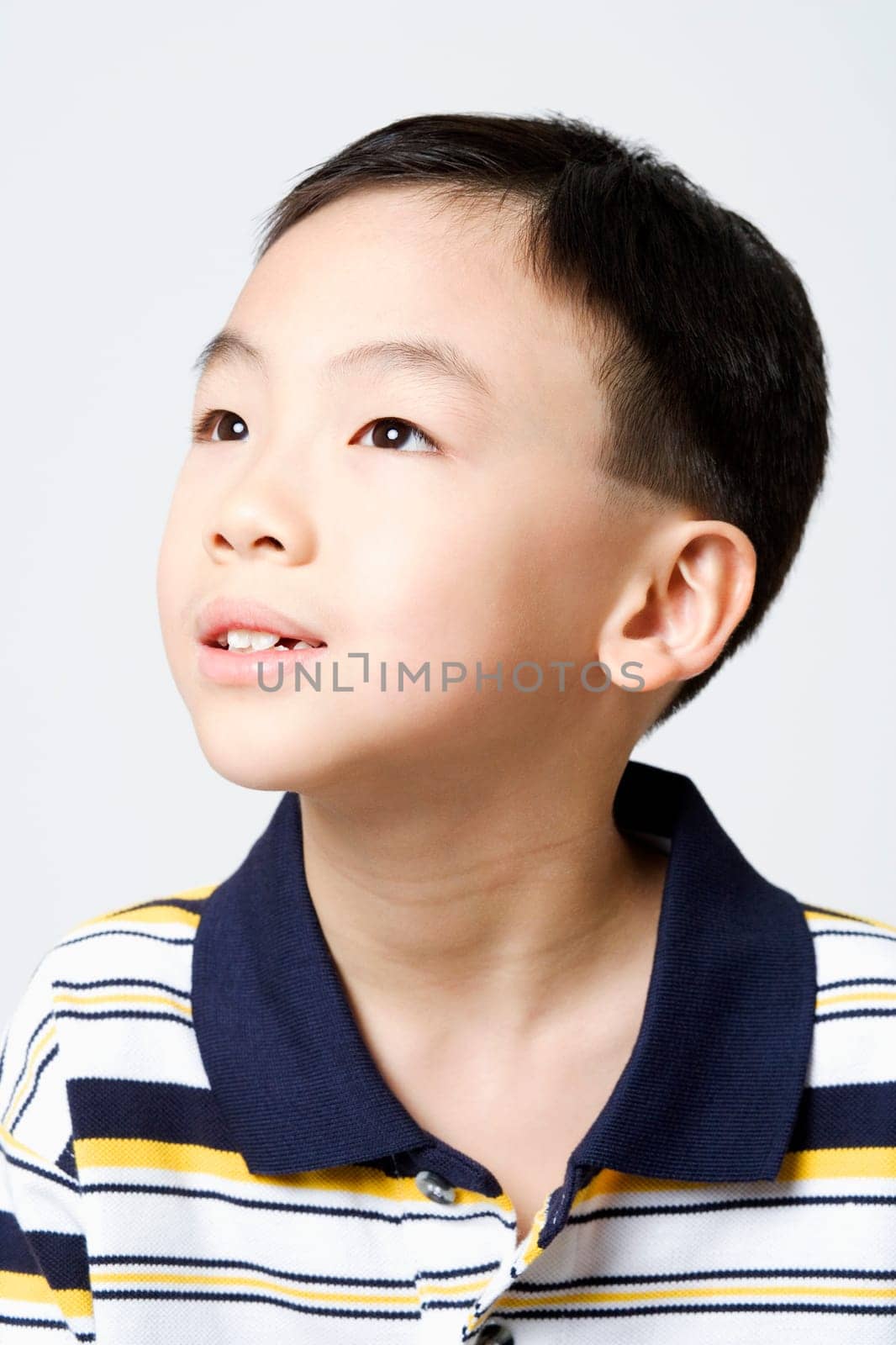 Close-up of a boy looking away